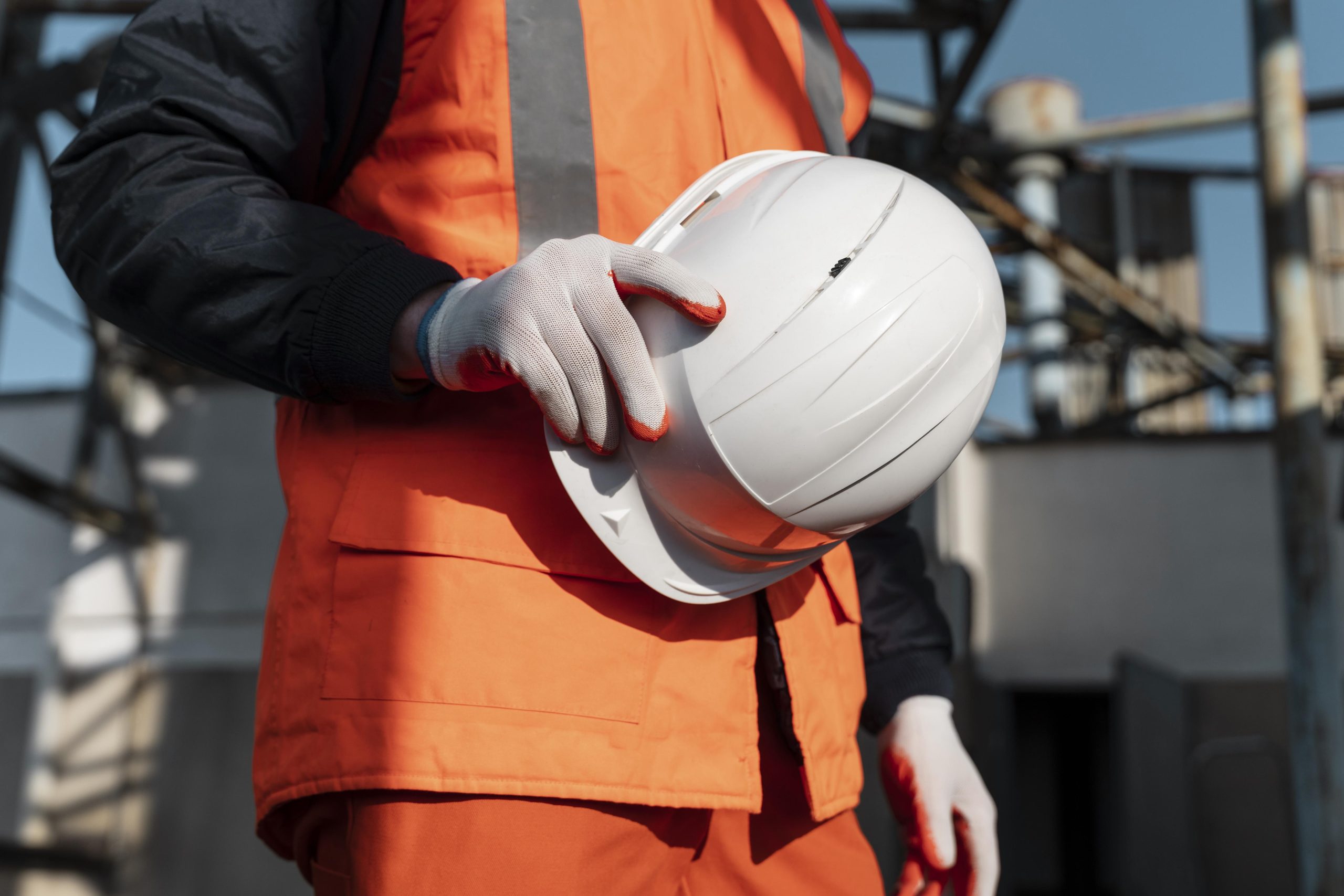 close-up-hand-holding-safety-helmet